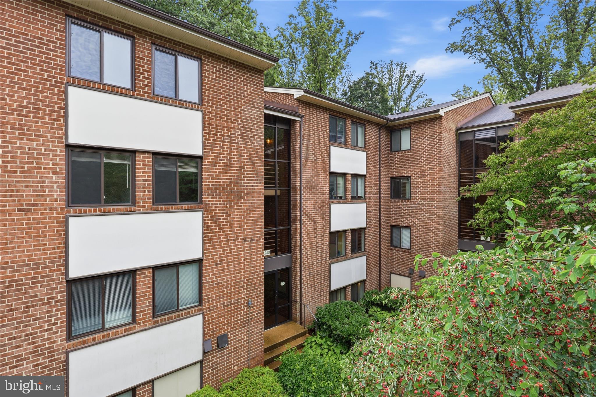 1540 Northgate Square, Unit 21B Reston, VA 20190 - Photo 6 of 24 a front view of a house with balcony