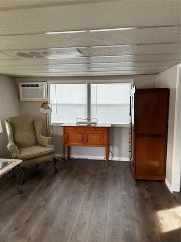 a living room with a couch and a window