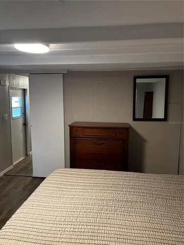 a bedroom with a bed and a cabinets