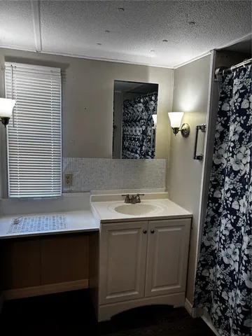 a bathroom with a shower curtain