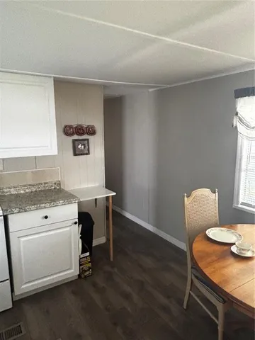 a view of workspace with wooden floor