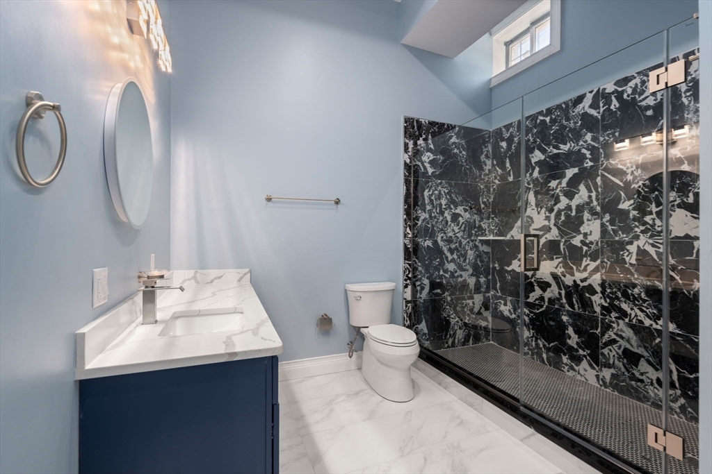 10 Hitching Post Lane Weston, MA 02493 - Photo 41 of 42 a bathroom with a sink toilet and shower