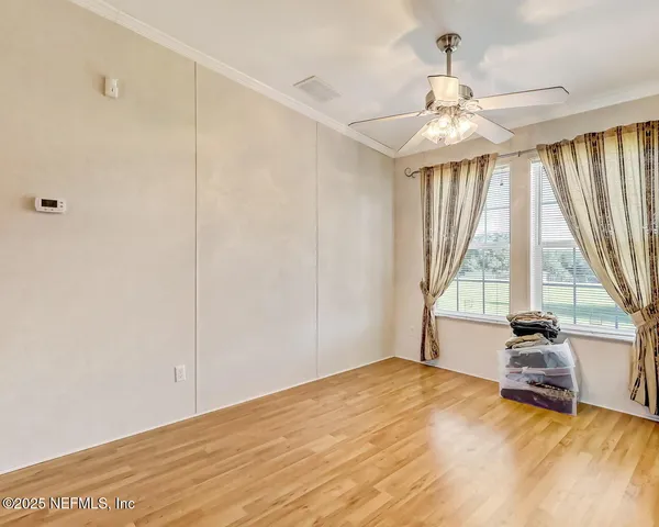 a view of an empty room and window
