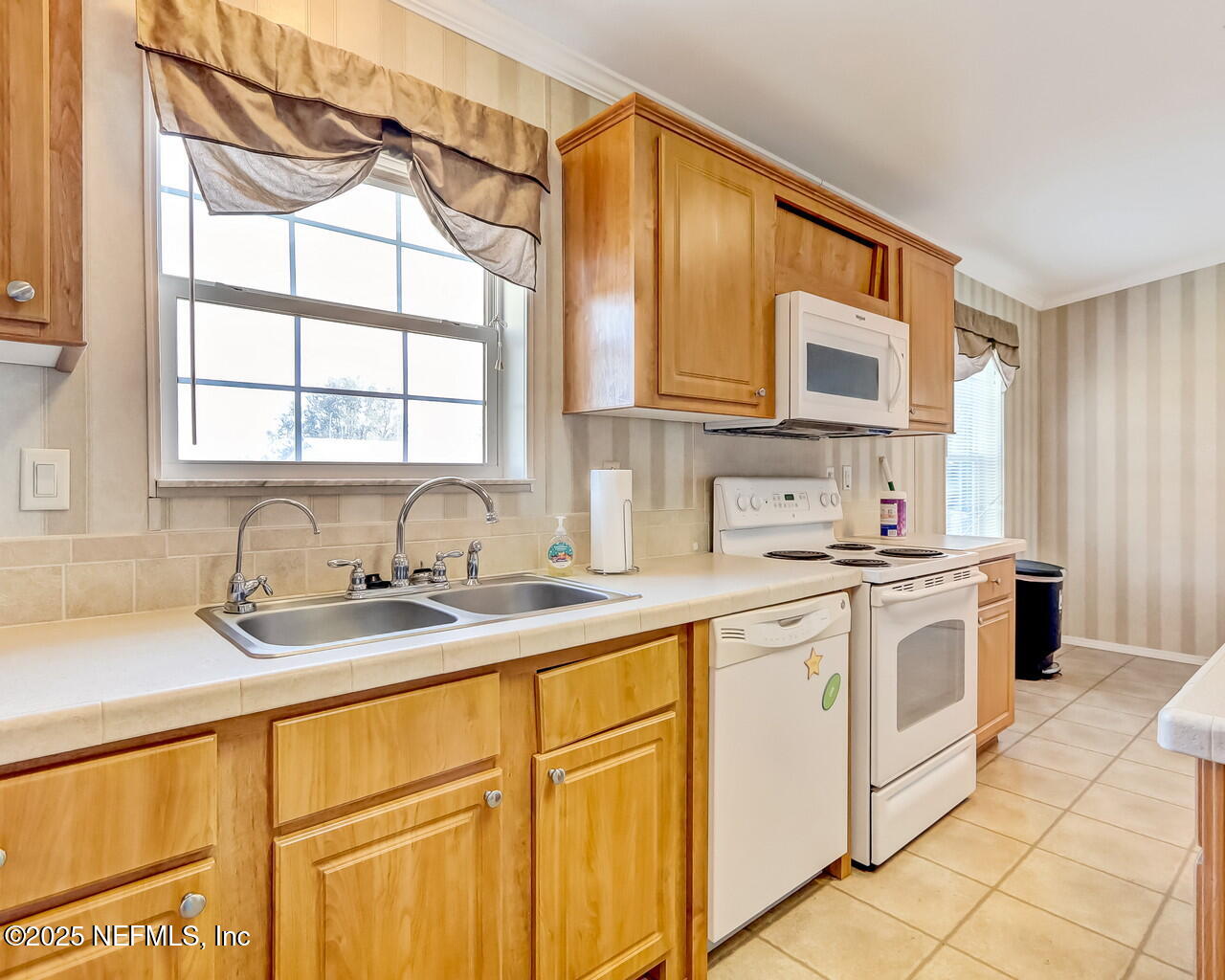 5891 Sequoia Road Keystone Heights, FL 32656 - Photo 20 of 53 a kitchen with stainless steel appliances granite countertop a sink and cabinets