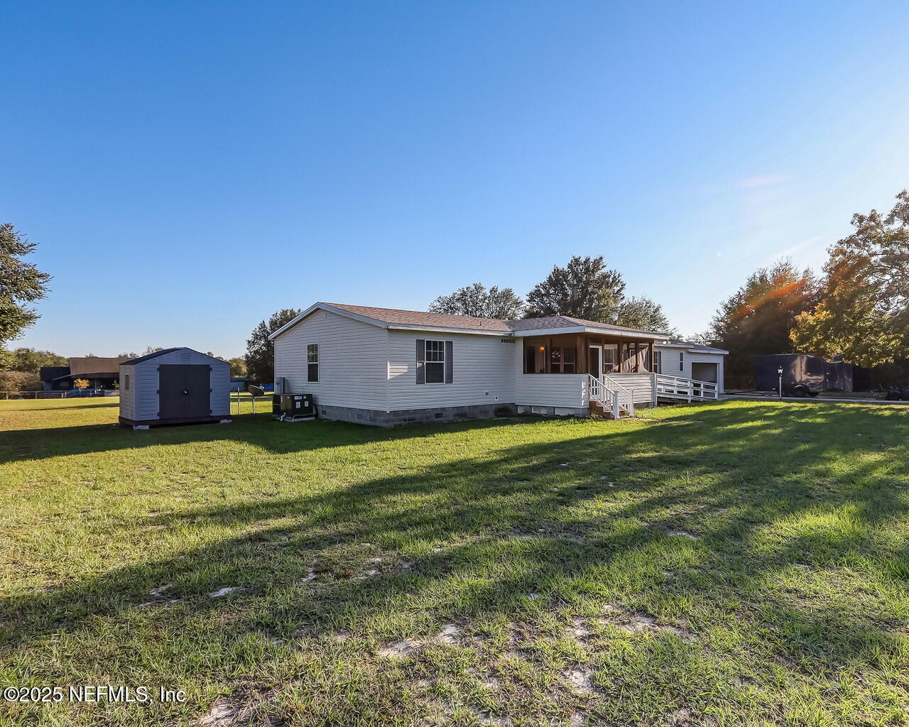 5891 Sequoia Road Keystone Heights, FL 32656 - Photo 2 of 53 a front view of house with yard and seating