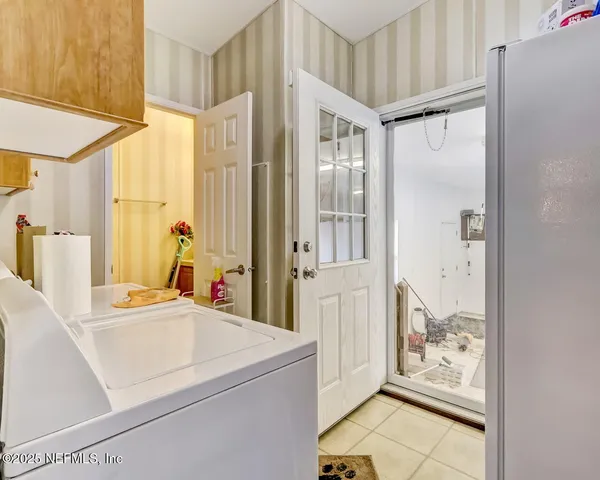 a view of a hallway with front door