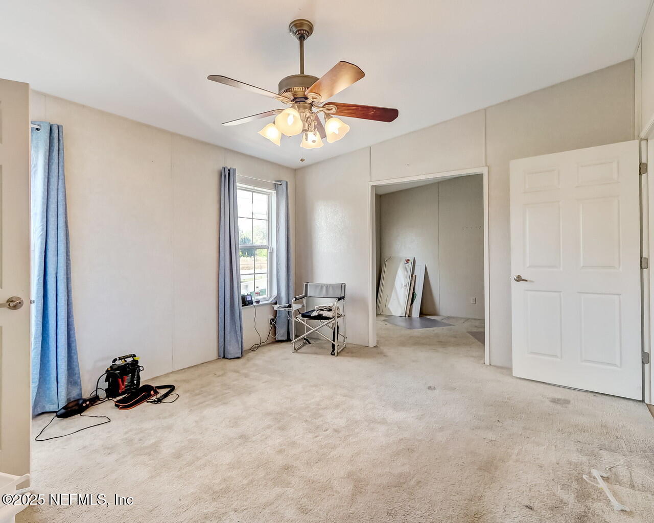5891 Sequoia Road Keystone Heights, FL 32656 - Photo 27 of 53 a living room with furniture and a chandelier