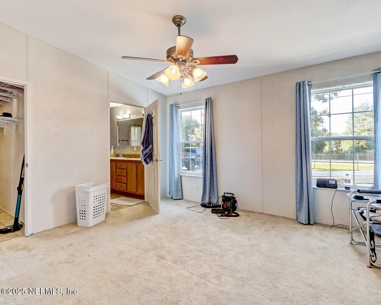 5891 Sequoia Road Keystone Heights, FL 32656 - Photo 30 of 53 a view of a livingroom with a ceiling fan and window