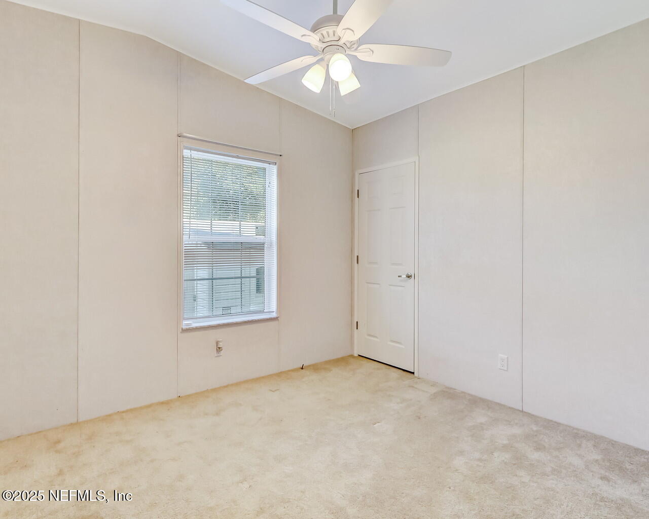 5891 Sequoia Road Keystone Heights, FL 32656 - Photo 34 of 53 an empty room with a window and a fan