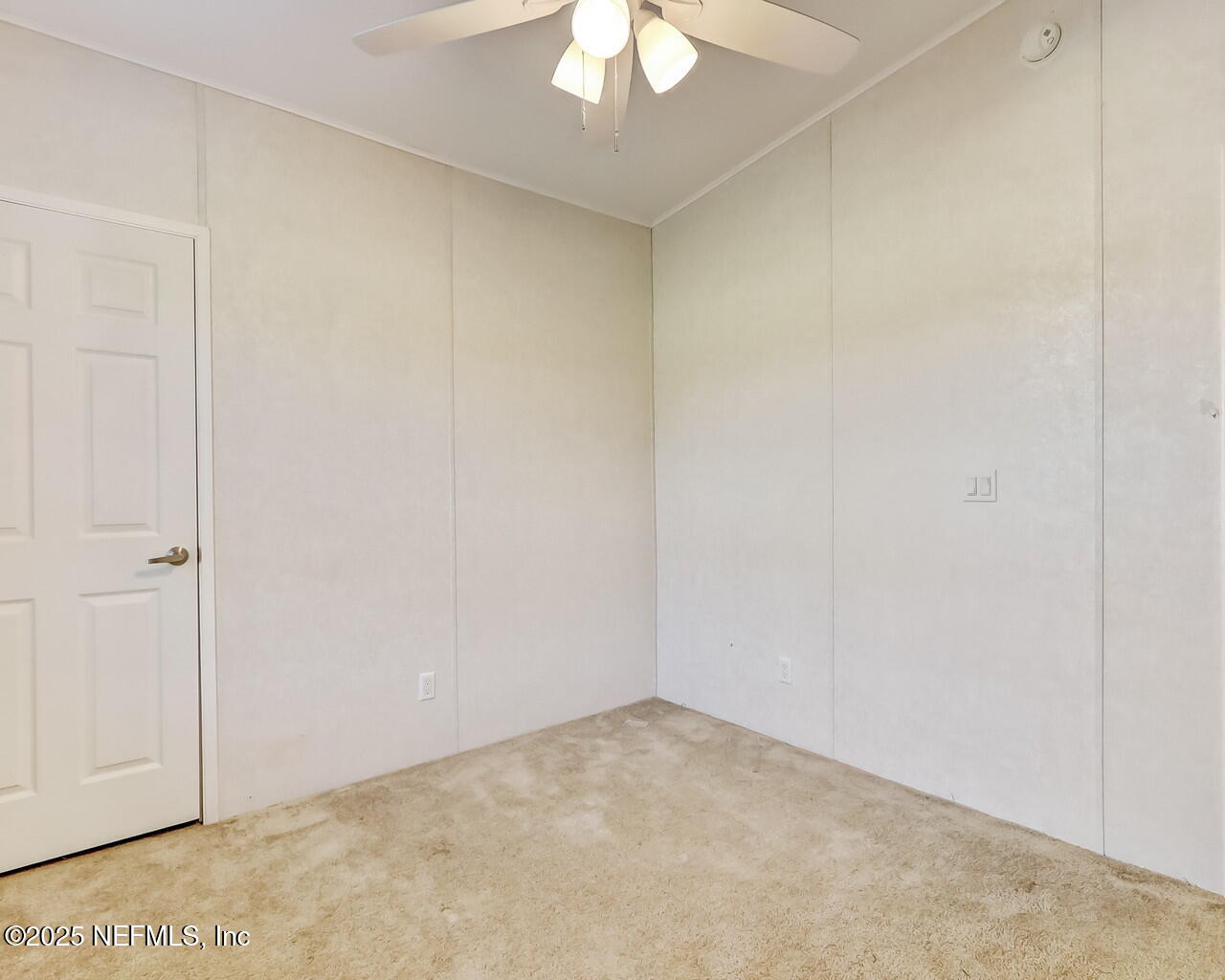 5891 Sequoia Road Keystone Heights, FL 32656 - Photo 35 of 53 an empty room with a chandelier fan