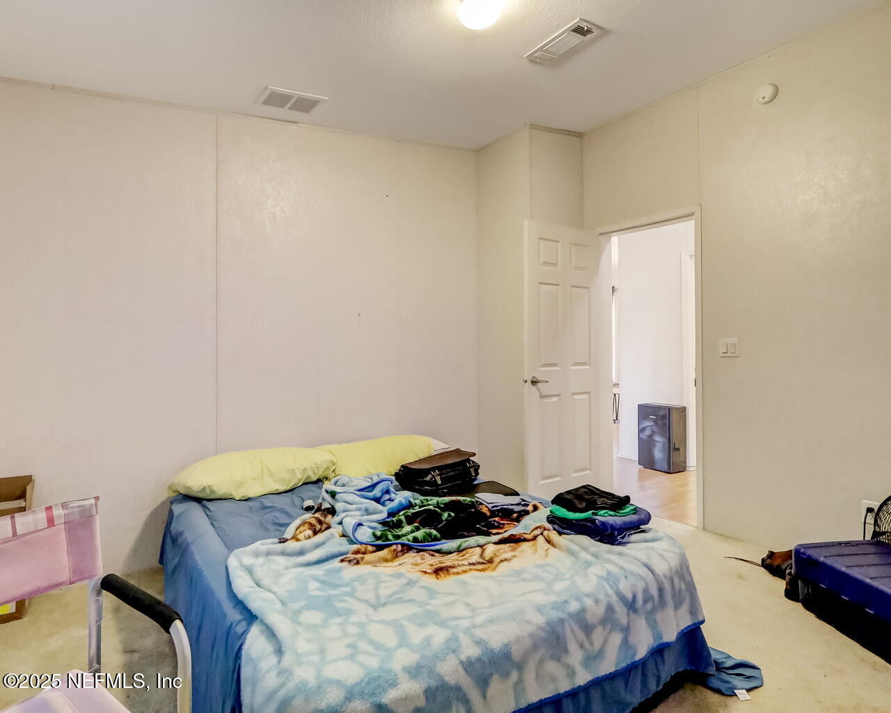 5891 Sequoia Road Keystone Heights, FL 32656 - Photo 36 of 53 a bedroom with a bed and a table in it