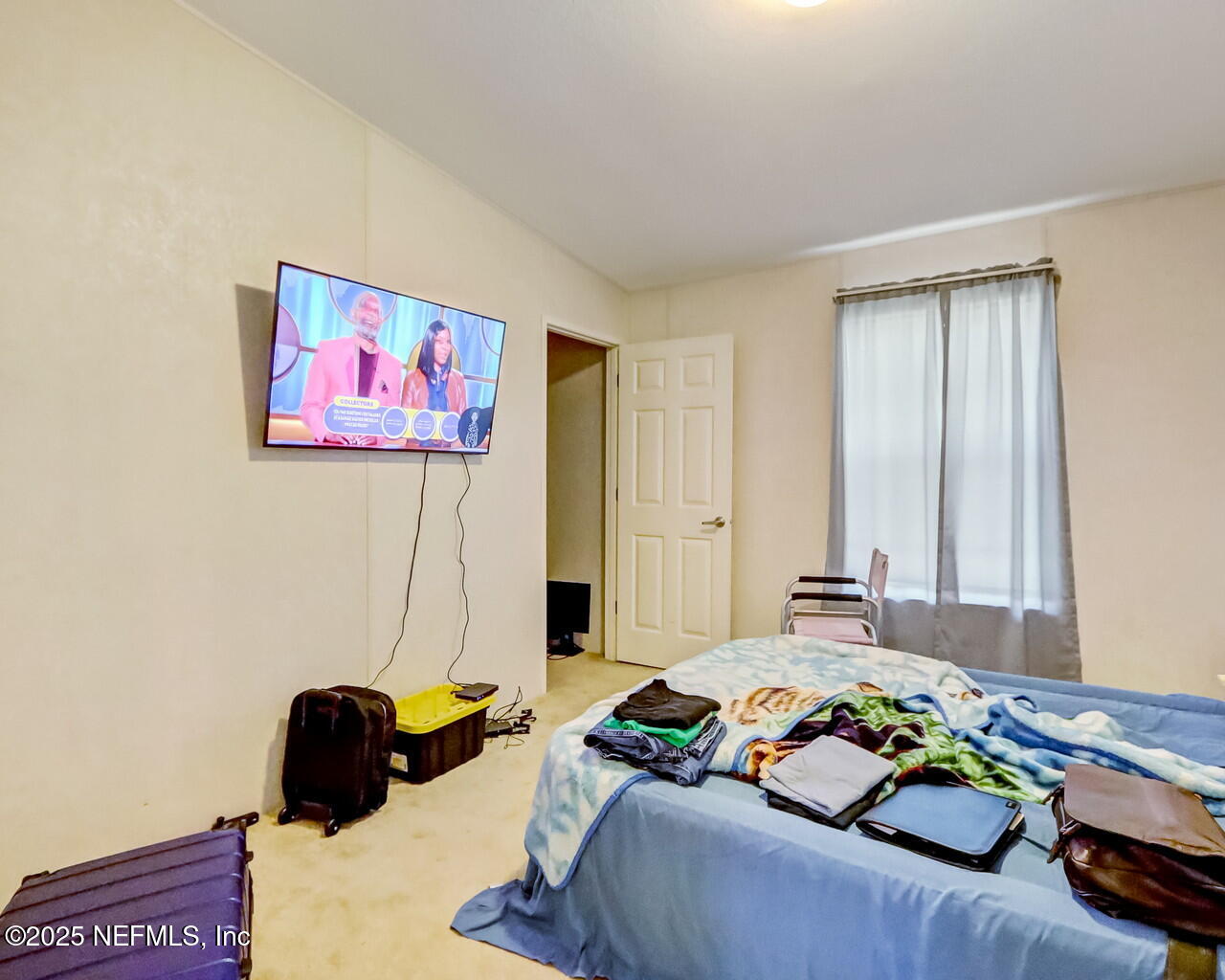 5891 Sequoia Road Keystone Heights, FL 32656 - Photo 37 of 53 a bedroom with a bed and a couch