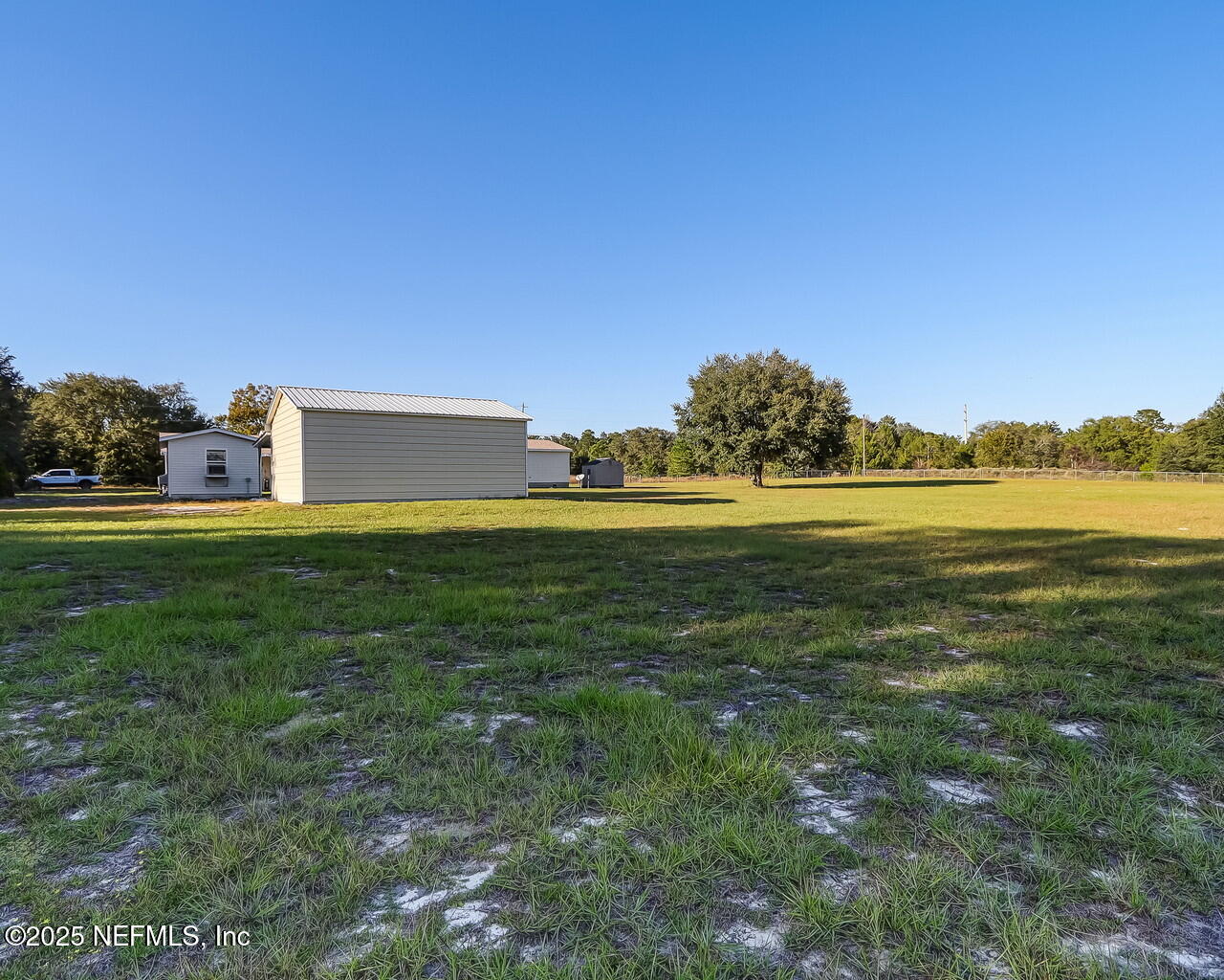 5891 Sequoia Road Keystone Heights, FL 32656 - Photo 53 of 53 a backyard of a house with lots of green space
