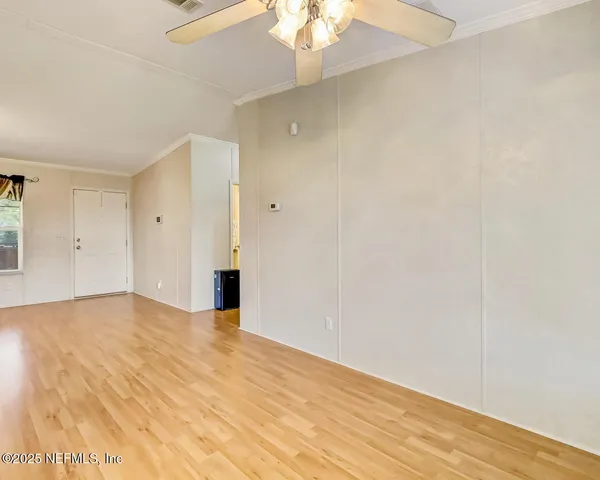 a view of an empty room with a window