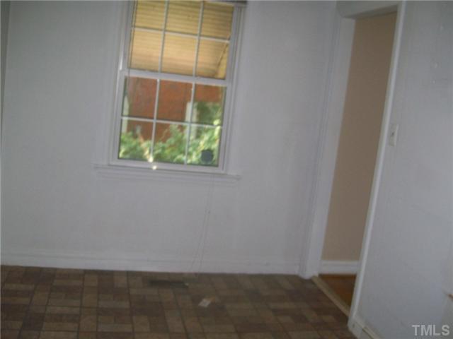 2332 Stevens Road Raleigh, NC 27610 - Photo 5 of 8 an empty room with a window