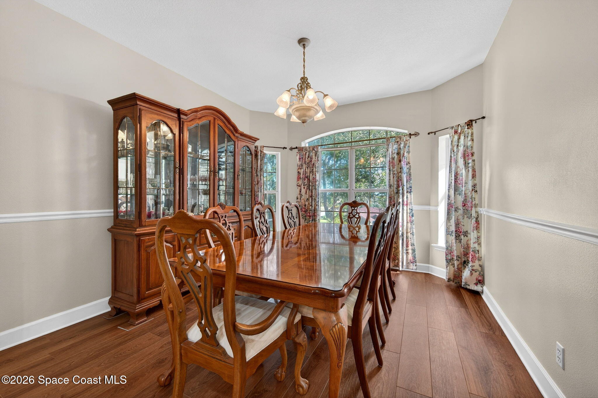 3676 South Ridge Circle Titusville, FL 32796 - Photo 13 of 74 a view of a dining room with furniture and wooden floor