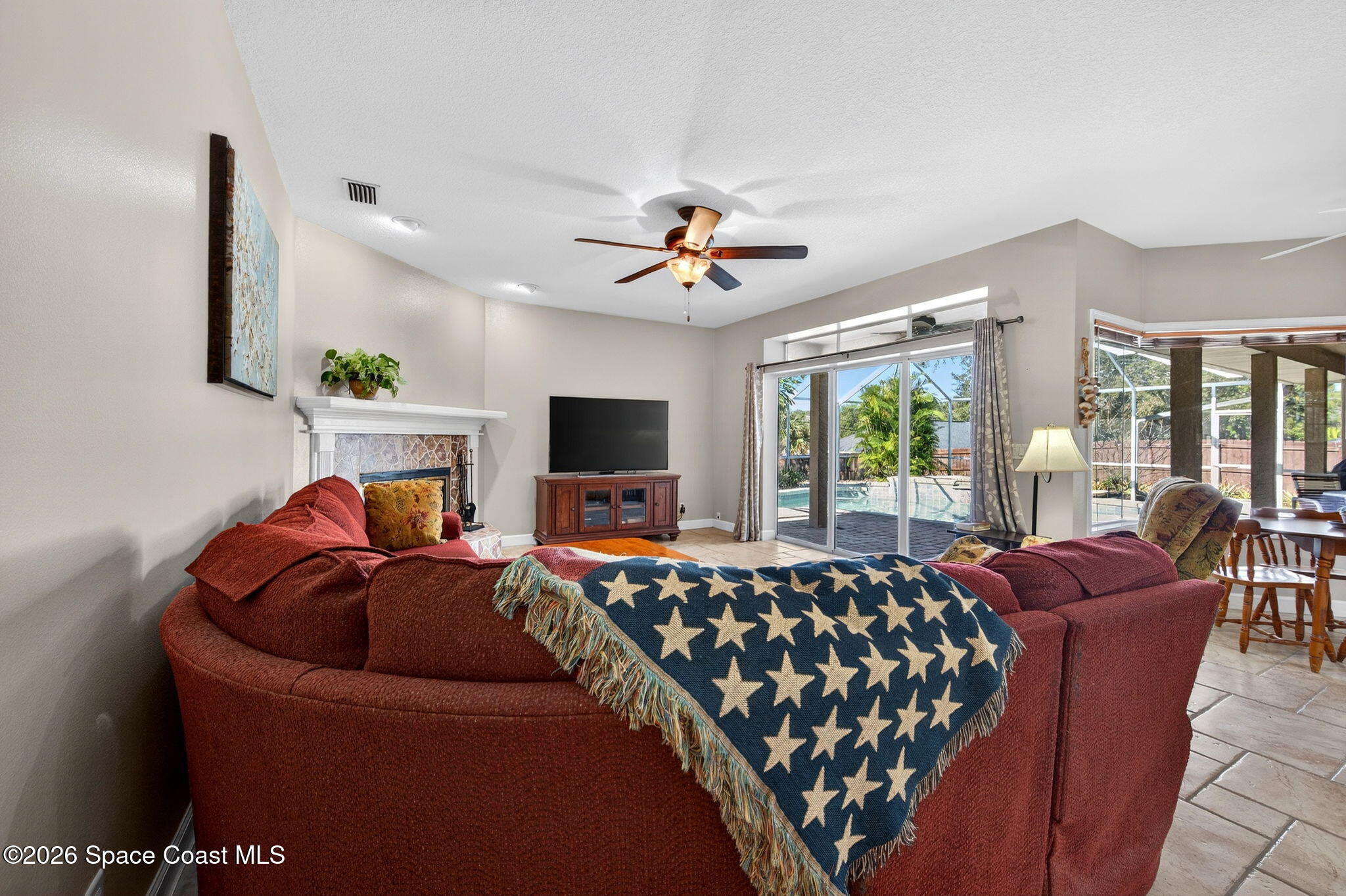 3676 South Ridge Circle Titusville, FL 32796 - Photo 25 of 74 a bedroom with furniture and a flat screen tv