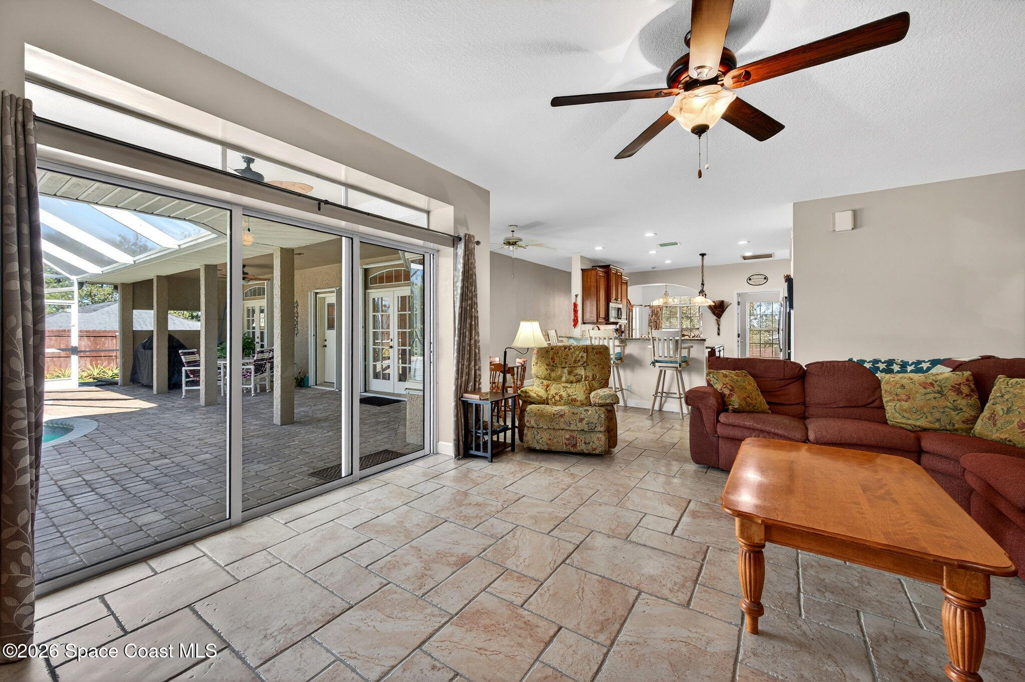 3676 South Ridge Circle Titusville, FL 32796 - Photo 26 of 74 a living room with furniture and a chandelier