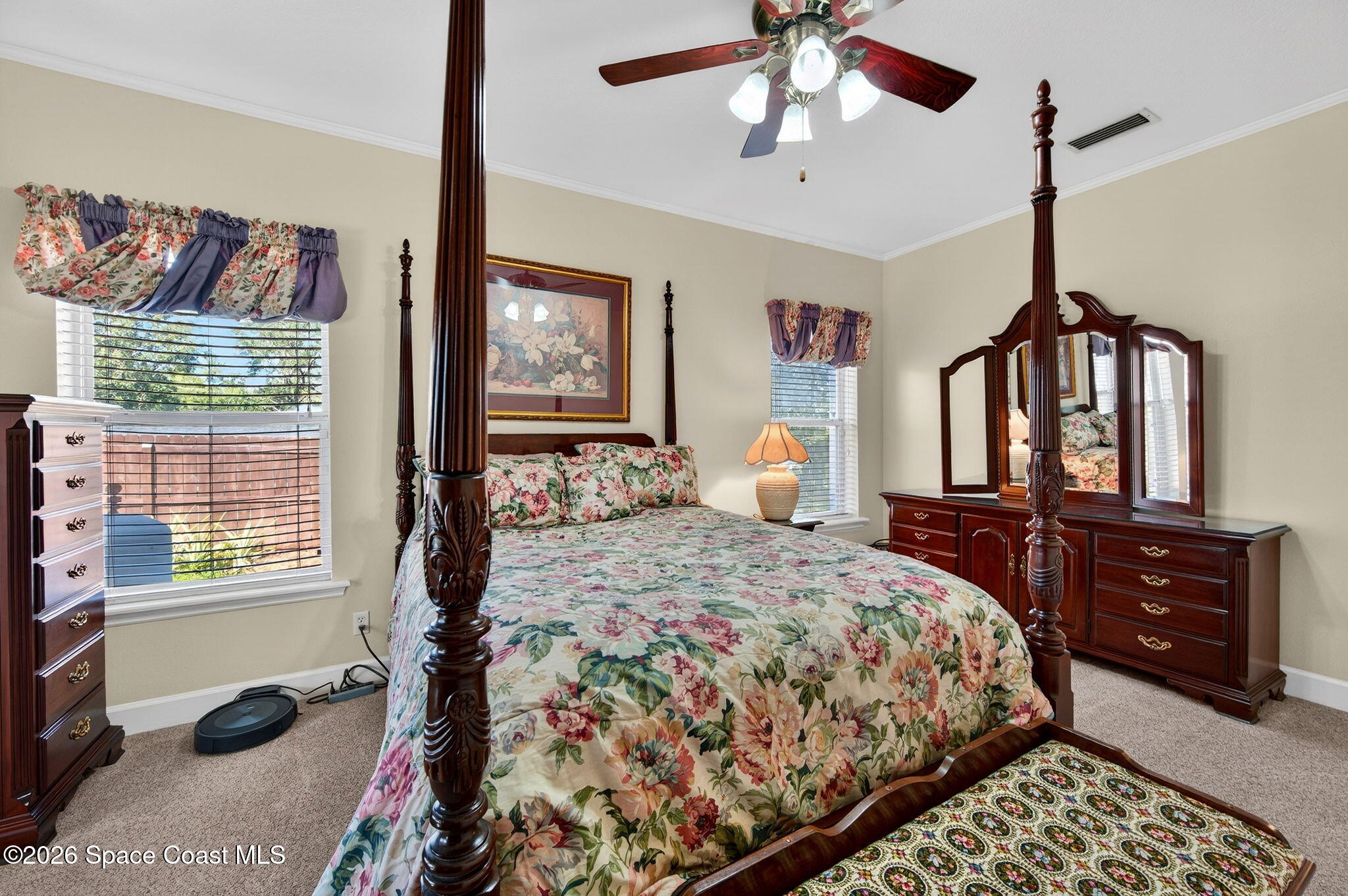 3676 South Ridge Circle Titusville, FL 32796 - Photo 32 of 74 a bedroom with a bed dresser and a window