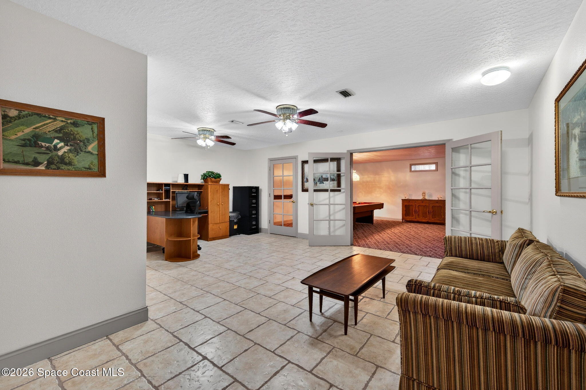 3676 South Ridge Circle Titusville, FL 32796 - Photo 47 of 74 a living room with furniture and kitchen view