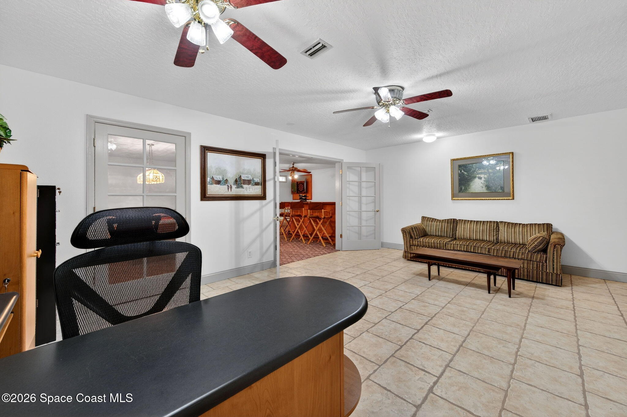 3676 South Ridge Circle Titusville, FL 32796 - Photo 50 of 74 a living room with furniture and a wooden floor