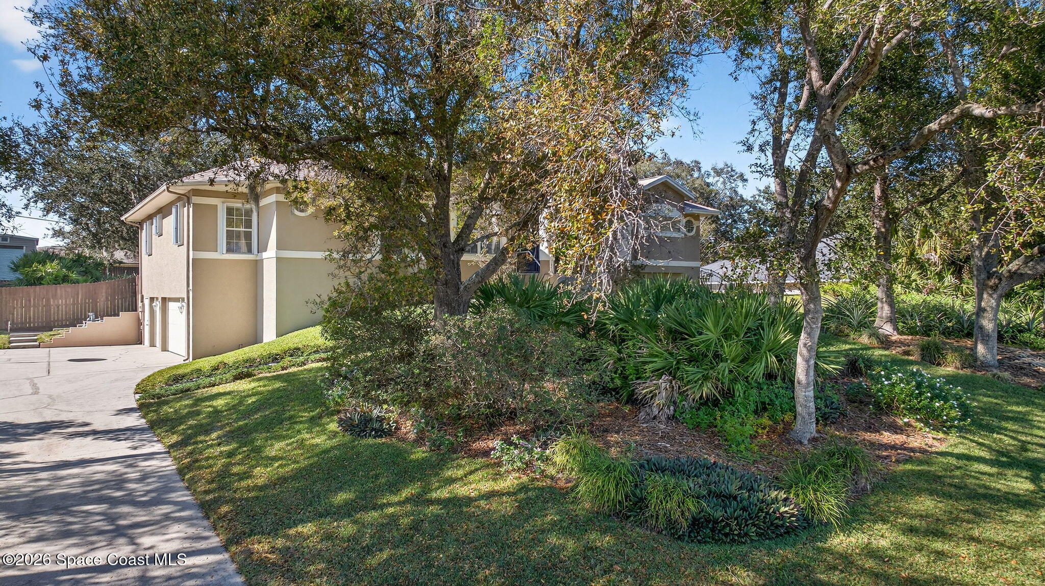 3676 South Ridge Circle Titusville, FL 32796 - Photo 70 of 74 a front view of a house with garden