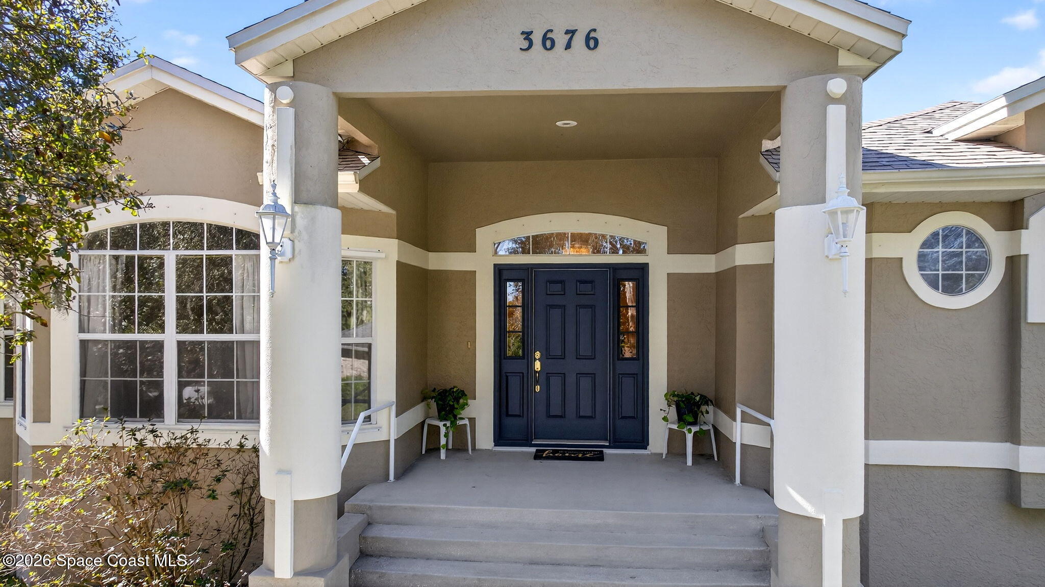 3676 South Ridge Circle Titusville, FL 32796 - Photo 7 of 74 a view of a entryway door of the house