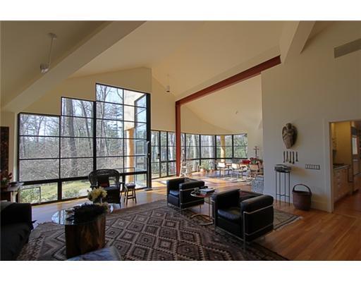 3 Cornelia Drive Greenwich, CT 06830 - Photo 3 of 16 a living room with furniture a large window and wooden floor