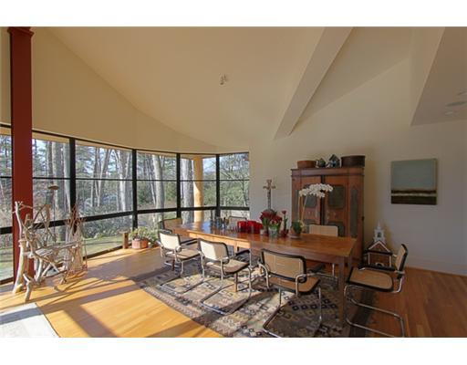 3 Cornelia Drive Greenwich, CT 06830 - Photo 4 of 16 a living room with furniture a flat screen tv and a large window