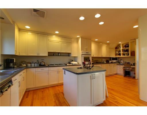 3 Cornelia Drive Greenwich, CT 06830 - Photo 5 of 16 a kitchen with stainless steel appliances granite countertop a sink and cabinets