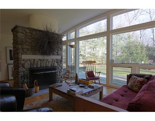 3 Cornelia Drive Greenwich, CT 06830 - Photo 7 of 16 a living room with furniture large window and a fireplace