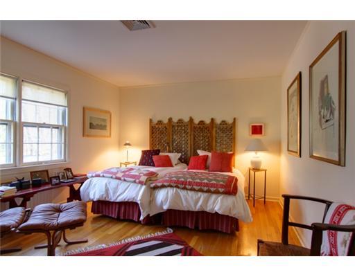 3 Cornelia Drive Greenwich, CT 06830 - Photo 10 of 16 a bedroom with a bed lamps and a large mirror