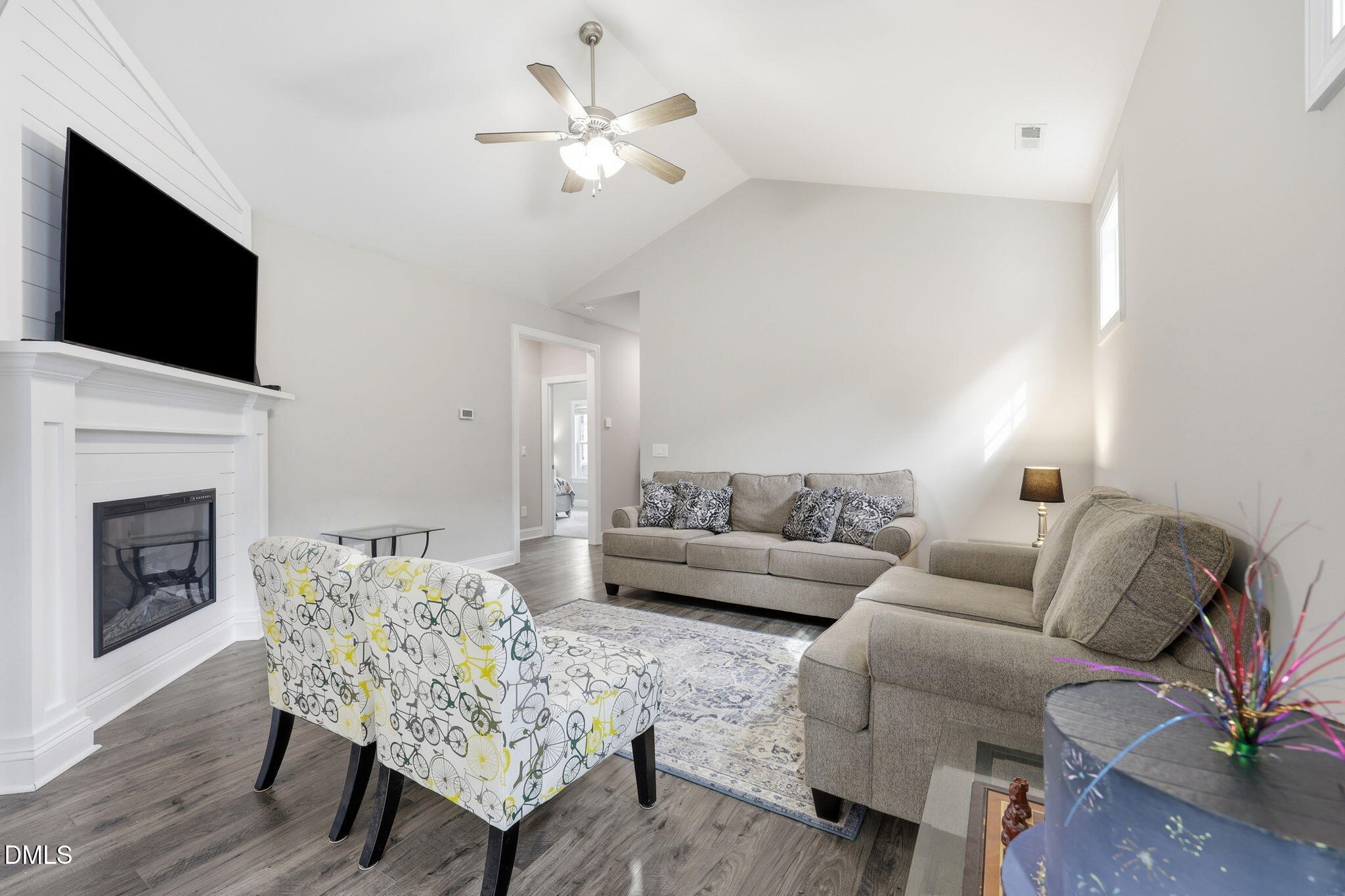 709 South Pollock Street Selma, NC 27576 - Photo 9 of 30 a living room with furniture a fireplace and a flat screen tv