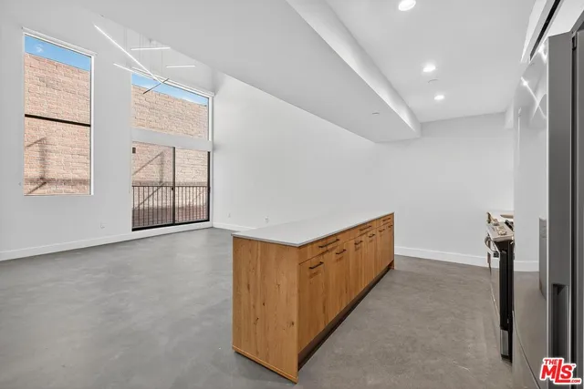 a view of an empty room with windows