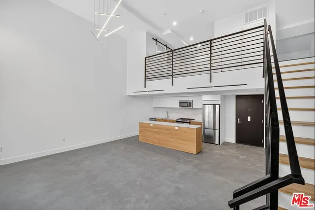 an empty room with wooden floor