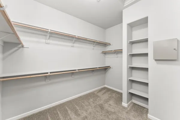 a view of an empty walk in closet