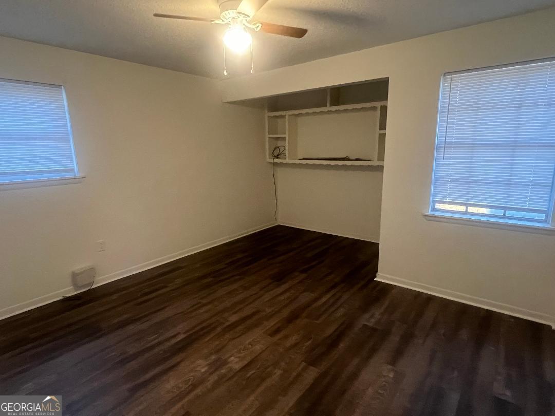 2293 Burkhalter Road Statesboro, GA 30458 - Photo 5 of 10 a view of a room with wooden floor and a window