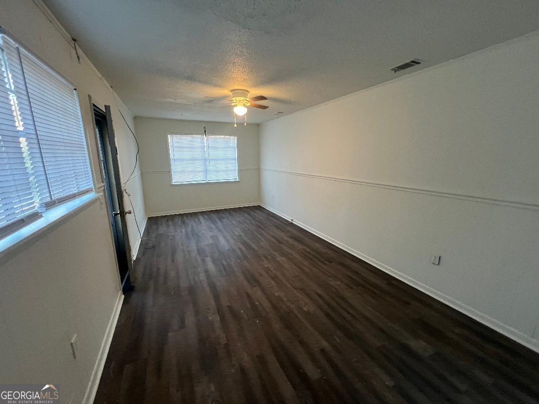 2293 Burkhalter Road Statesboro, GA 30458 - Photo 6 of 10 a view of wooden floor in an empty room