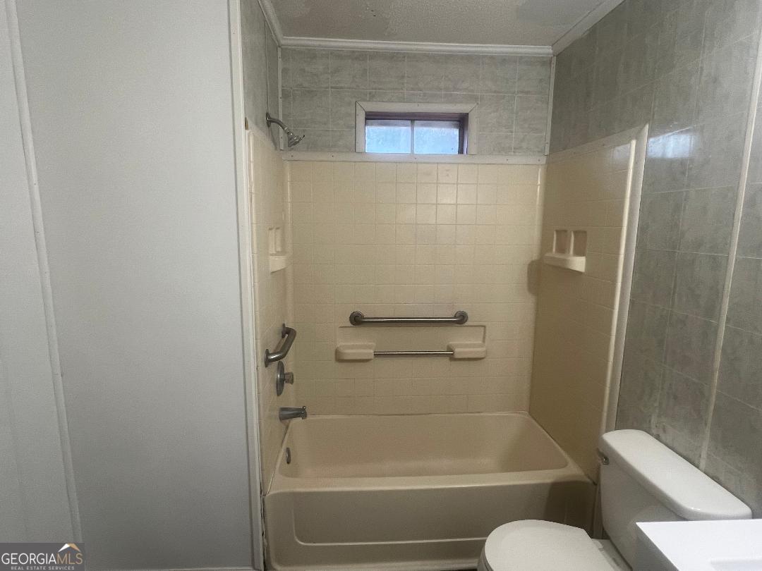 2293 Burkhalter Road Statesboro, GA 30458 - Photo 10 of 10 a bathroom with a shower and a toilet