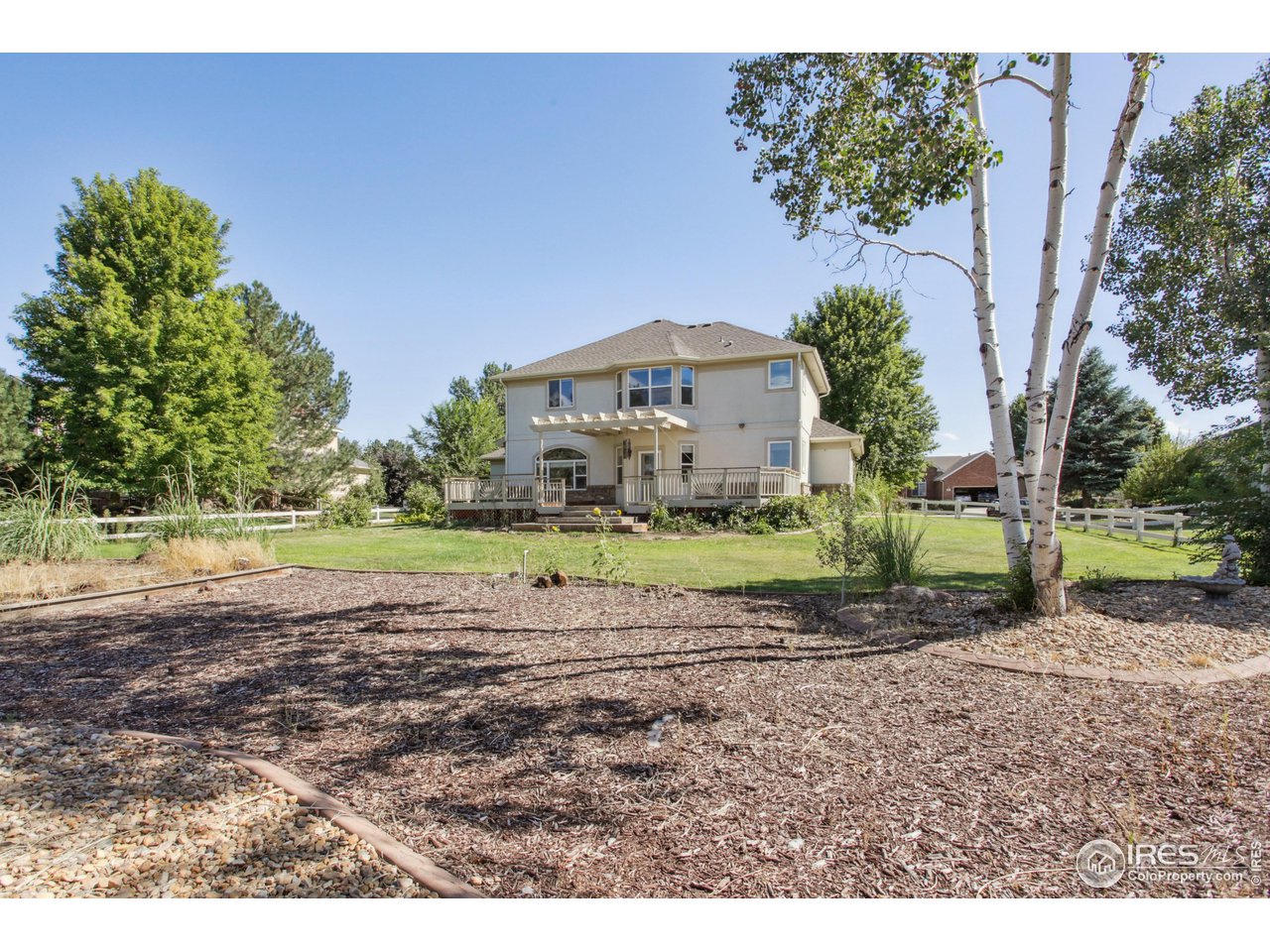 6735 Saddleback Avenue Firestone, CO 80504 - Photo 25 of 26 a view of a house with a yard