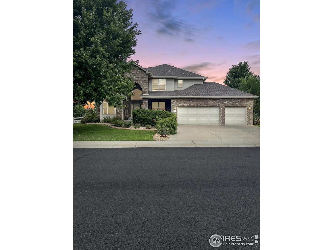 6735 Saddleback Avenue Firestone, CO 80504 - Photo 26 of 26 a front view of a house with a garden