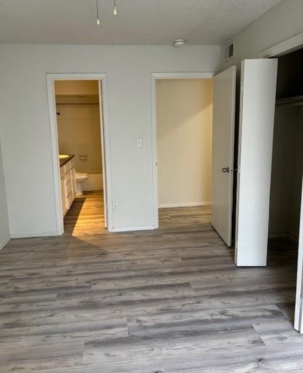2729 Hurstview Drive, Unit A Hurst, TX 76054 - Photo 15 of 21 Bedroom/Door to bathroom