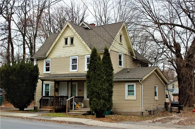 a front view of a house with garage