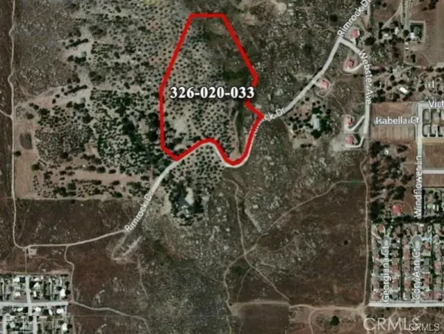 a view of a town with mountains in the background