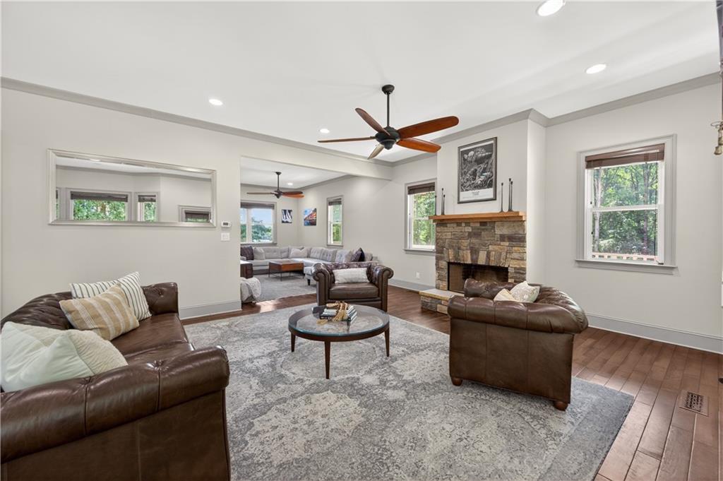 632 Geiger Road Jefferson, GA 30549 - Photo 16 of 55 a living room with furniture a fireplace and a window