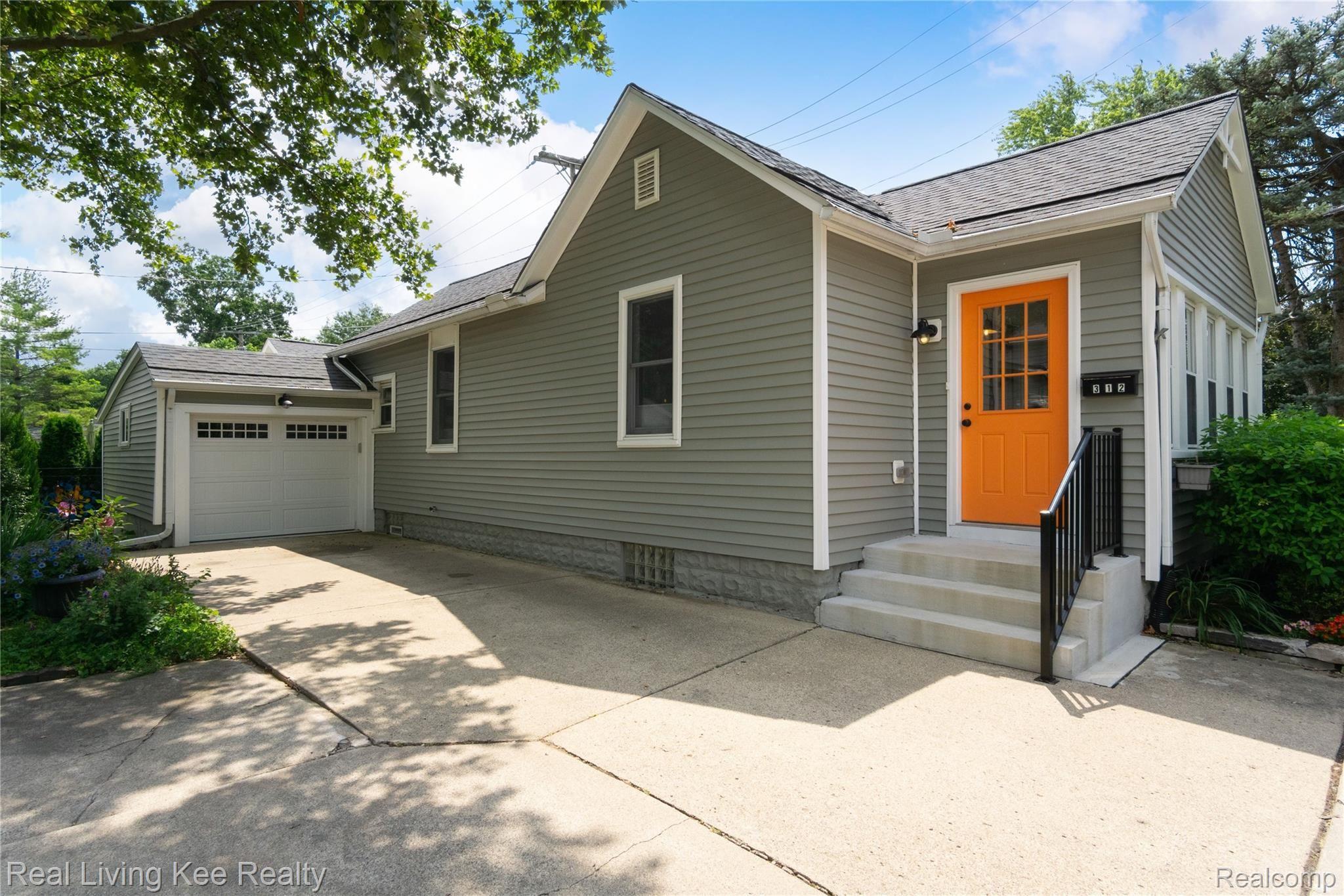 312 Wilcox Street Rochester, MI 48307 - Photo 2 of 38 What's behind the orange door?? A super cute enclosed porch!