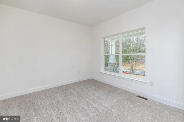 a kitchen with kitchen island a sink stove and refrigerator