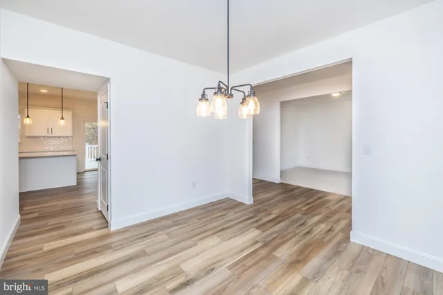 a bathroom with a sink a toilet a mirror and vanity
