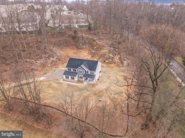 a view of a hallway view with wooden floor and staircase