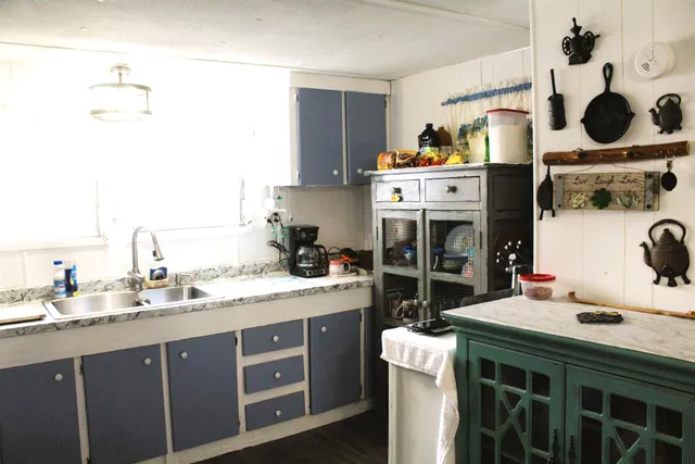 a kitchen with a stove and a sink